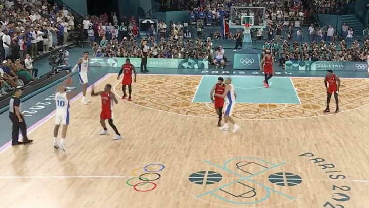 Fournier lets it fly with the shot clock running down against Canada. 