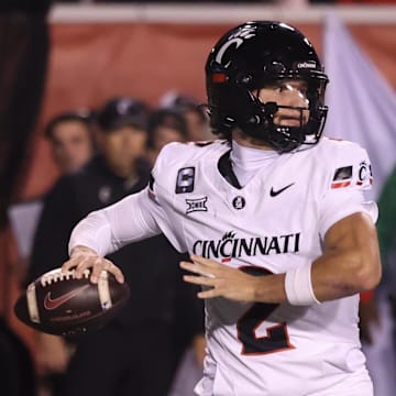 Nov 1, 2025; Salt Lake City, Utah, USA; Cincinnati Bearcats quarterback Brendan Sorsby (2) throws the ball against the Utah Utes during the second quarter at Rice-Eccles Stadium. Mandatory Credit: Rob Gray-Imagn Images