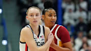 Dec 21, 2024; Hartford, Connecticut, USA; UConn Huskies guard Paige Bueckers (5) and USC Trojans guard JuJu Watkins (12) on the court in the first half at XL Center. 