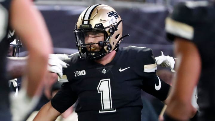 Purdue Boilermakers quarterback Hudson Card (1) celebrates with teammates 