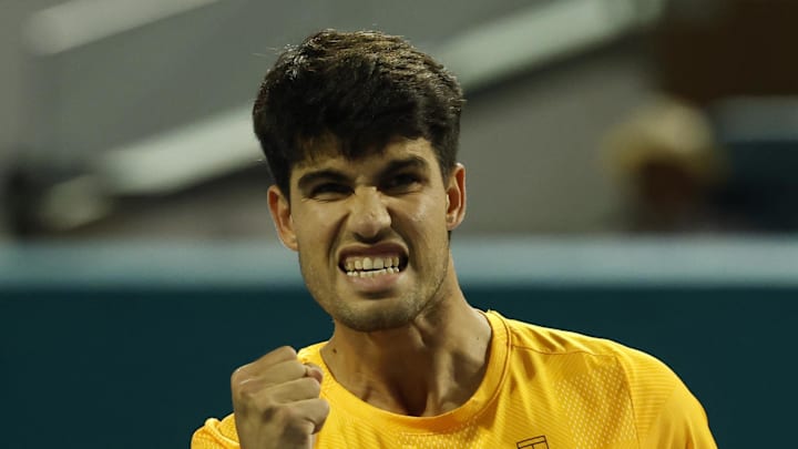 Carlos Alcaraz reacts after winning a point