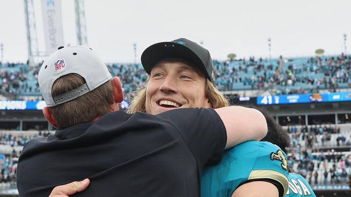 Jan 4, 2026; Jacksonville, Florida, USA; Jacksonville Jaguars quarterback Trevor Lawrence (16) celebrates with head coach Liam Coen (obscured) after the game against the Tennessee Titans at EverBank Stadium. 