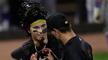 Wisconsin Timber Rattlers' Marco Dinges (8) celebrates with Andrew Fischer (11) after making a play at home plate against the Quad Cities River Bandits Wednesday, August 27, 2025, at Neuroscience Group Field at Fox Cities Stadium in Grand Chute, Wisconsin. Quad City won 9-5.