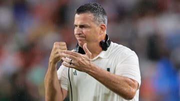 Sep 20, 2025; Miami Gardens, Florida, USA; Miami Hurricanes head coach Mario Cristobal reacts against the Florida Gators during the first quarter at Hard Rock Stadium. Mandatory Credit: Sam Navarro-Imagn Images