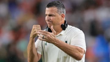 Sep 20, 2025; Miami Gardens, Florida, USA; Miami Hurricanes head coach Mario Cristobal reacts against the Florida Gators during the first quarter at Hard Rock Stadium. Mandatory Credit: Sam Navarro-Imagn Images