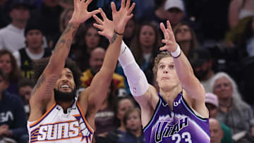 Oct 27, 2025; Salt Lake City, Utah, USA; Phoenix Suns forward Isaiah Livers (18) and Utah Jazz forward Lauri Markkanen (23) t: Rob Gray-Imagn Images