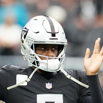 Nov 2, 2025; Paradise, Nevada, USA;  Las Vegas Raiders quarterback Geno Smith (7) warms up before the game against the Jacksonville Jaguars at Allegiant Stadium. Mandatory Credit: Stephen R. Sylvanie-Imagn Images
