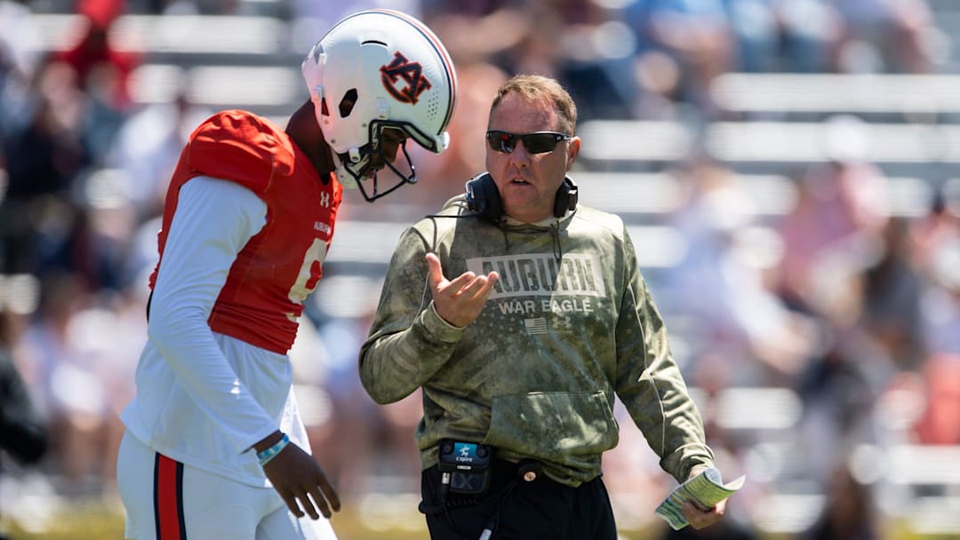 Auburn Tigers head coach Hugh Freeze talks with quarterback Deuce Knight (9)