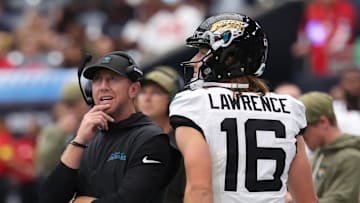 Nov 9, 2025; Houston, Texas, USA; Jacksonville Jaguars head coach Liam Coen and quarterback Trevor Lawrence (16) on the sidelines during the first half against the Houston Texans at NRG Stadium. Mandatory Credit: Thomas Shea-Imagn Images