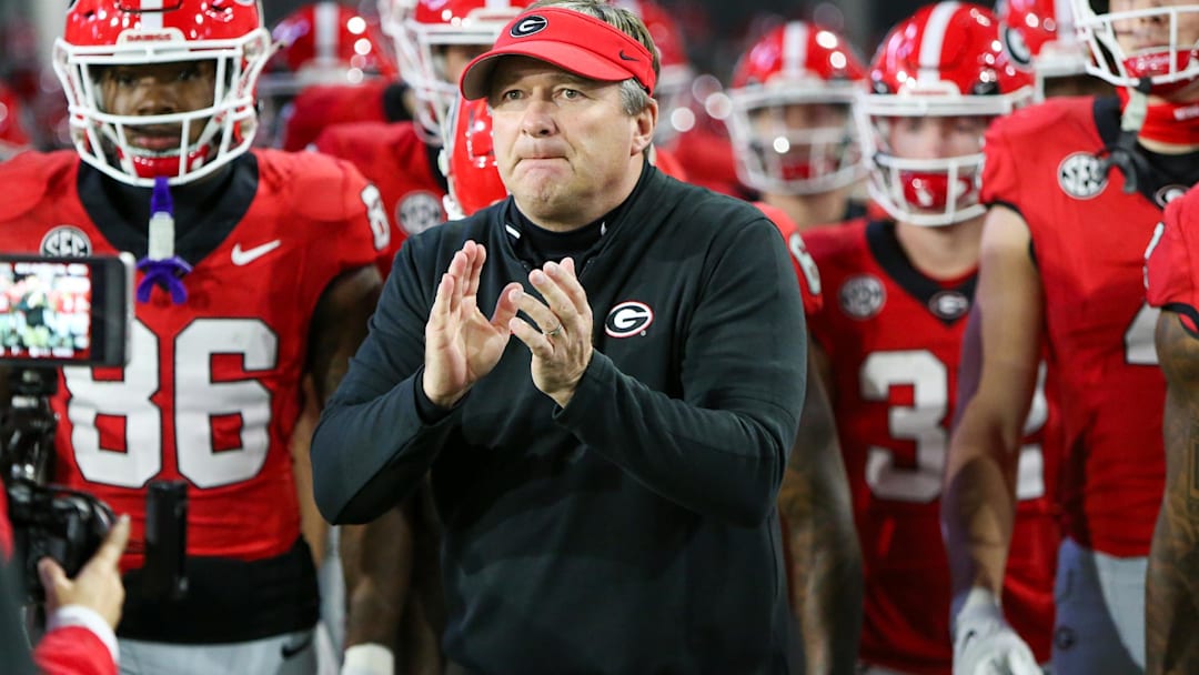 Nov 25, 2023; Atlanta, Georgia, USA; Georgia Bulldogs head coach Kirby Smart runs on the field with his team before a game against the Georgia Tech Yellow Jackets at Bobby Dodd Stadium at Hyundai Field. Mandatory Credit: Brett Davis-Imagn Images