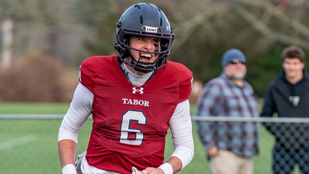 Quarterback Peter Bourque has a big smile after running in a touchdown.