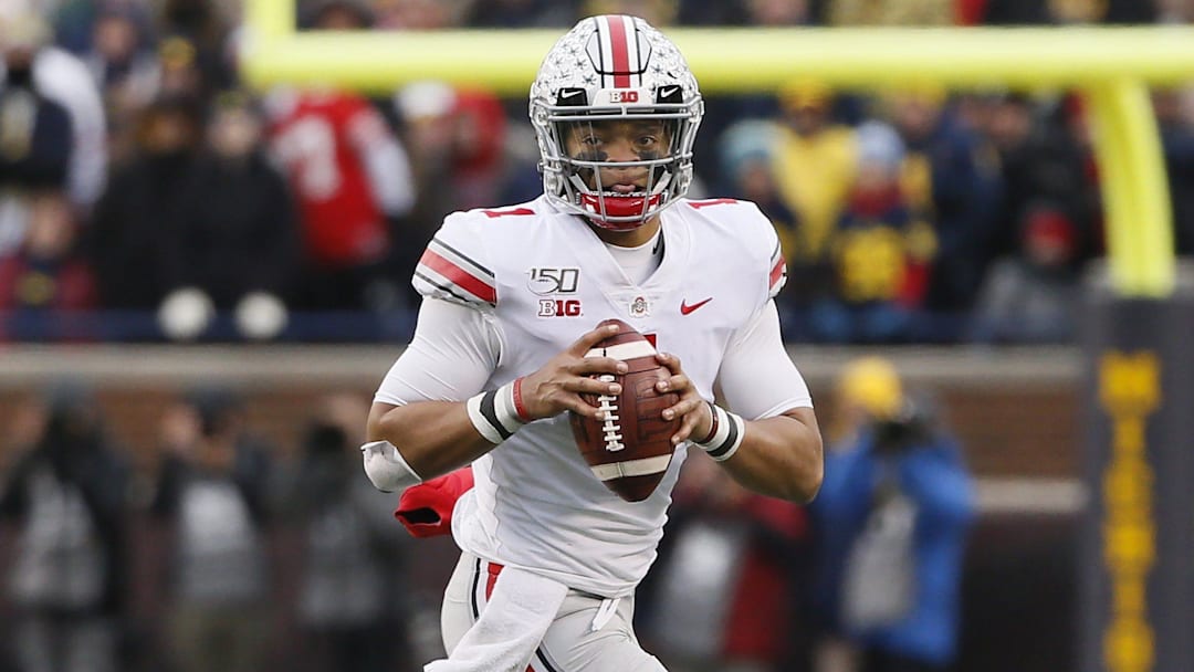 Ohio State Buckeyes quarterback Justin Fields (1) rolls out of the pocket during the fourth quarter of the NCAA football game against the Michigan Wolverines at Michigan Stadium in Ann Arbor, Mich. on Saturday, Nov. 30, 2019.  [Adam Cairns/Dispatch]

Thw1mvrkslc6xjm8ntm5xirz0i