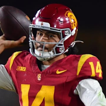 Nov 7, 2025; Los Angeles, California, USA; Southern California Trojans quarterback Jayden Maiava (14) throws against the Northwestern Wildcats during the second half at the Los Angeles Memorial Coliseum. Mandatory Credit: Gary A. Vasquez-Imagn Images
