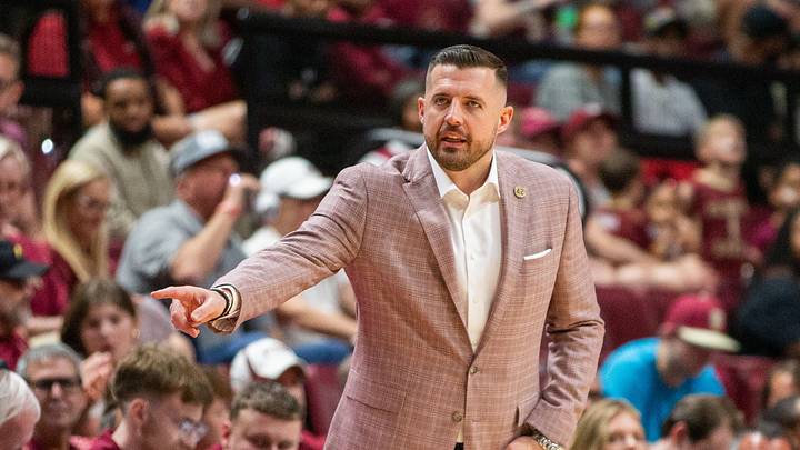 Florida State Seminoles head coach Luke Loucks signals to a player from the sideline. The Florida State Seminoles hosted the Southern Methodist University Mustangs at the Tucker Civic Center on Saturday, March 7, 2026.