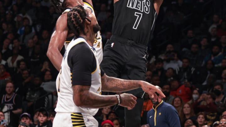 Oct 31, 2022; Brooklyn, New York, USA; Brooklyn Nets forward Kevin Durant (7) shoots the ball against Indiana Pacers guard Buddy Hield (24) and forward James Johnson (16) during the first half at Barclays Center. Mandatory Credit: Vincent Carchietta-USA TODAY Sports