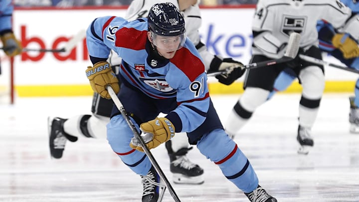 Apr 1, 2024; Winnipeg, Manitoba, CAN; Winnipeg Jets center Cole Perfetti (91) skates through the neutral zone in the second period against the Los Angeles Kings at Canada Life Centre. Mandatory Credit: James Carey Lauder-Imagn Images