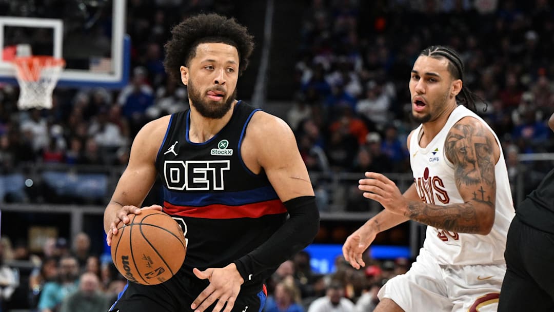 Feb 27, 2026; Detroit, Michigan, USA;  Detroit Pistons guard Cade Cunningham (2) drive past Cleveland Cavaliers guard Jaylon Tyson (20)  in the first half at Little Caesars Arena. Mandatory Credit: Lon Horwedel-Imagn Images