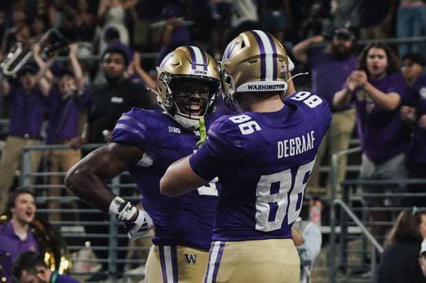 Jeremiah Hunter and Decker DeGraaf celebrate the freshman tight end's touchdown catch.