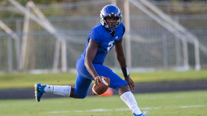Trinity Christian quarterback Shedeur Sanders looks for an open teammate while rolling out against host Gadsden County (Fla.) in 2020.