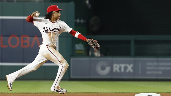 Sep 12, 2024; Washington, District of Columbia, USA; Washington Nationals shortstop CJ Abrams (5) makes a throw to first base after fielding a ground ball by Miami Marlins outfielder Cristian Pache (not pictured) during the fourth inning at Nationals Park.