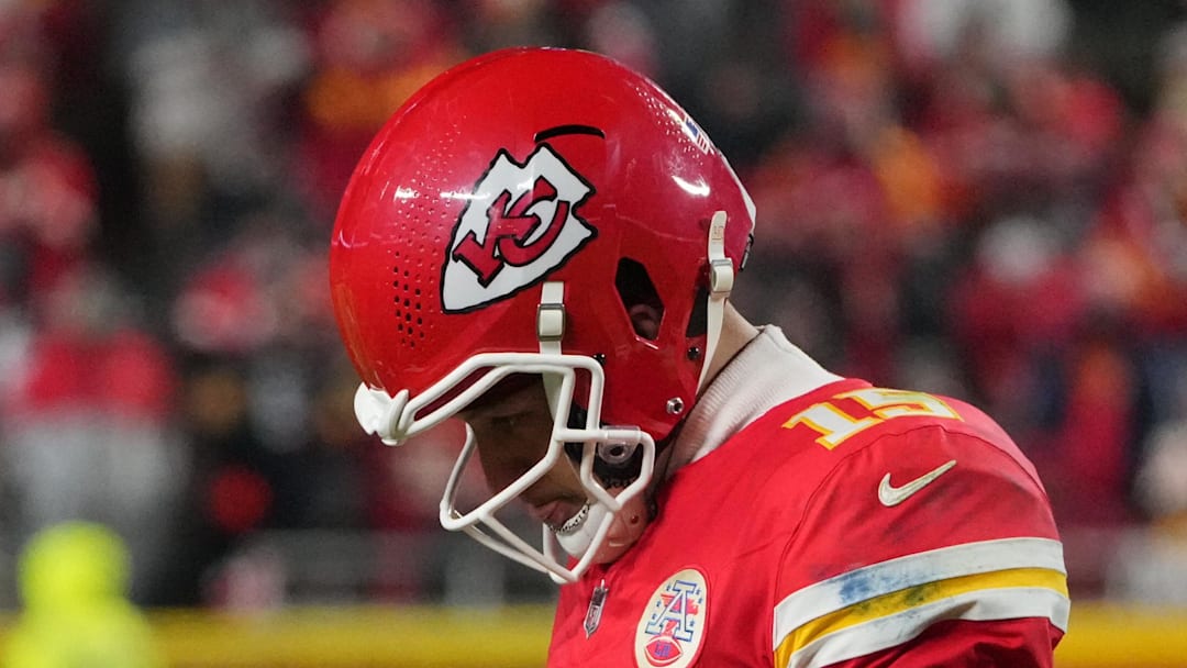 Dec 7, 2025; Kansas City, Missouri, USA; Kansas City Chiefs quarterback Patrick Mahomes (15) lowers his head during the fourth quarter against the Houston Texans at GEHA Field at Arrowhead Stadium. Mandatory Credit: Denny Medley-Imagn Images