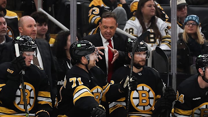 Oct 28, 2025; Boston, Massachusetts, USA; Boston Bruins head coach Marco Sturm talks with left wing Viktor Arvidsson (71) during the second period against the New York Islanders at TD Garden. Mandatory Credit: Winslow Townson-Imagn Images