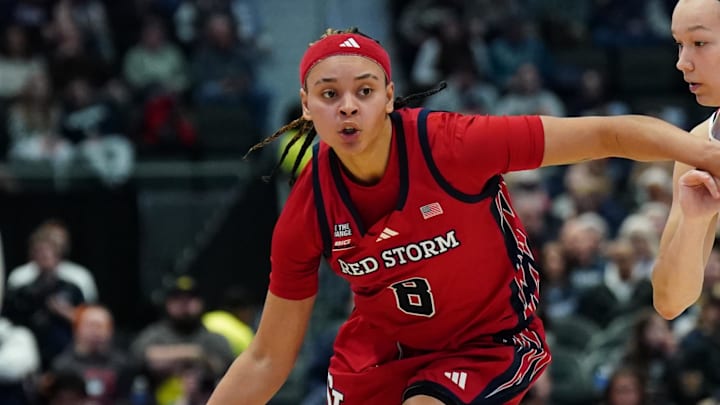 Jan 7, 2026; Hartford, Connecticut, USA; St. John's basketball guard Shaulana Wagner (8) drives the ball against UConn Huskies guard Kayleigh Heckel (9) in the second half at PeoplesBank Arena.