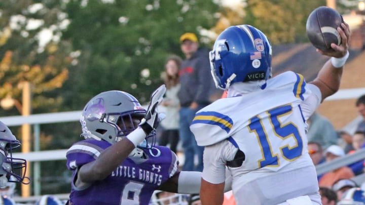 Ross' Tykell Patterson pressures Findlay's Ryan Montgomery.