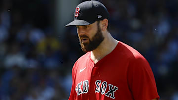 Boston Red Sox starting pitcher Lucas Giolito (54) leaves a baseball game against the Chicago Cubs during the sixth inning at Wrigley Field.