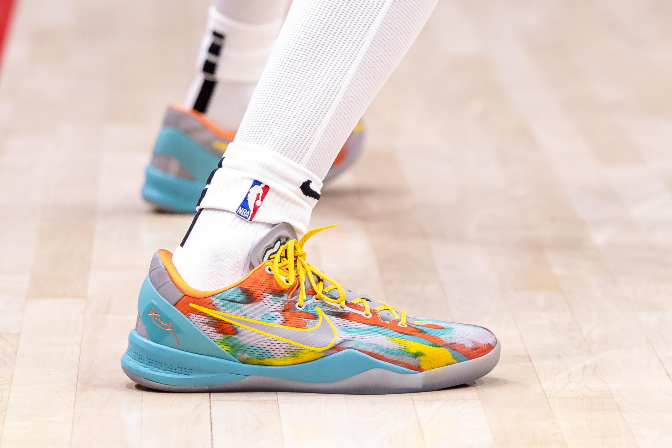 Portland Trail Blazers forward Dalano Banton's blue Nike Kobe sneakers.