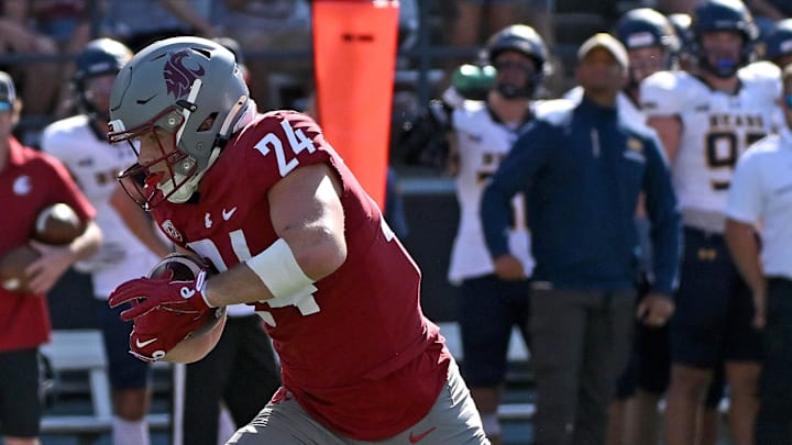 Sep 16, 2023; Pullman, Washington, USA; Washington State Cougars tight end Cooper Mathers (24) carries the ball against the Northern Colorado Bears in the first half at Gesa Field at Martin Stadium. Mandatory Credit: James Snook-USA TODAY Sports