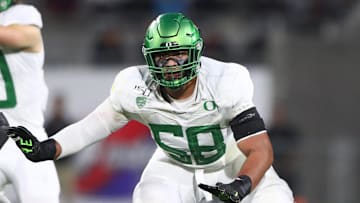 Oregon's first Outland Trophy winner and a first-round draft pick, Penei Sewell is an immediate starter on the Oregon all-time team. Mandatory Credit: Mark J. Rebilas-Imagn Images