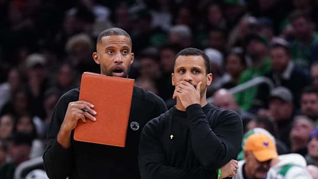 Boston Celtics head coach Joe Mazzulla and assistant coach Charles Lee watch from the sideline