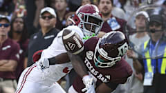 Alabama Crimson Tide defensive back Terrion Arnold (3) breaks up a pass.