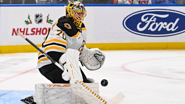Nov 27, 2024; Elmont, New York, USA;  Boston Bruins goaltender Joonas Korpisalo (70) makes a save against the New York Islanders during the second period at UBS Arena. Mandatory Credit: Dennis Schneidler-Imagn Images