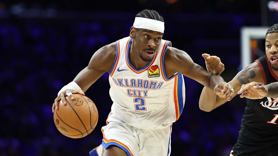 Oklahoma City Thunder guard Shai Gilgeous-Alexander drives past Philadelphia 76ers forward Dalen Terry.