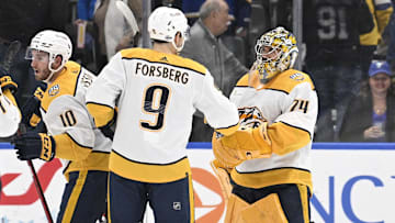 Feb 17, 2024; St. Louis, Missouri, USA; Nashville Predators left wing Filip Forsberg (9) congratulates goaltender Juuse Saros (74) after defeating the St. Louis Blues at Enterprise Center. Mandatory Credit: Jeff Le-Imagn Images