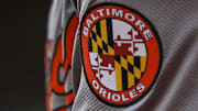 May 5, 2024; Cincinnati, Ohio, USA; The Baltimore Orioles logo on the sleeve of designated hitter Gunnar Henderson (2) as he prepares on deck during the seventh inning against the Cincinnati Reds at Great American Ball Park.