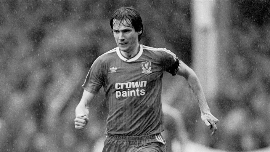 Alan Hansen striding forward in possession.
