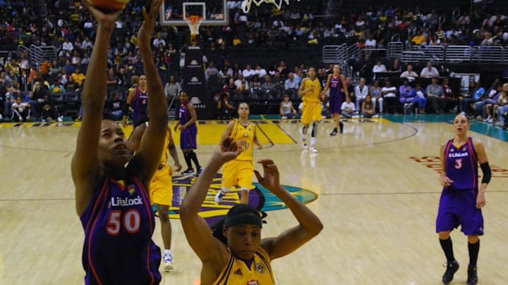 Jun 8, 2010; Los Angeles, CA, USA; Phoenix Mercury forward Tangela Smith (50) goes up for a shot as Los Angeles Sparks guard Betty Lennox (22) defends at the Staples Center. The Sparks defeated the Mercury 92-91. Mandatory Credit: Kirby Lee/Image of Sport-Imagn Images Jun 8, 2010; Los Angeles, CA, USA; Phoenix Mercury forward Tangela Smith (50) goes up for a shot as Los Angeles Sparks guard Betty Lennox (22) defends at the Staples Center. The Sparks defeated the Mercury 92-91. Mandatory Credit: Kirby Lee/Image of Sport-Imagn Images