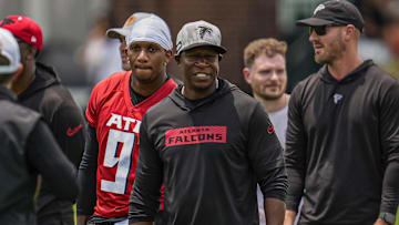 Jun 11, 2025; Atlanta, GA, USA; Atlanta Falcons quarterback Michael Penix Jr. (9) and head coach Raheem Morris on the field during Minicamp at Children's Healthcare of Atlanta Training Ground. Mandatory Credit: Dale Zanine-Imagn Images