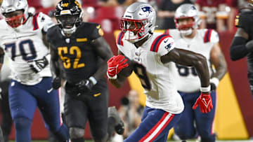Former New England Patriots wide receiver Matt Landers (9) runs after the catch during the second half against the Washington Commanders at Commanders Field.