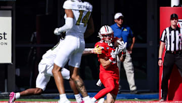 Oct 19, 2024; Tucson, Arizona, USA; Arizona Wildcats defensive back Jack Luttrell (13) intercepts a ball against the Colorado Buffaloes during the second quarter at Arizona Stadium. Mandatory Credit: Aryanna Frank-Imagn Images