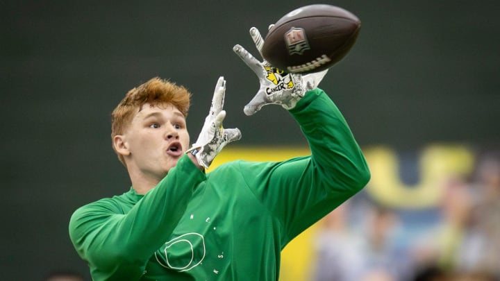 Oregon tight end Terrance Ferguson catches a pass from former Oregon quarterback Bo Nix during Oregon Pro Day Tuesday, March 12, 2024 at the Moshofsky Center in Eugene, Ore.