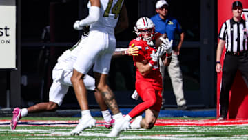 Oct 19, 2024; Tucson, Arizona, USA; Arizona Wildcats defensive back Jack Luttrell (13) intercepts a ball against the Colorado Buffaloes during the second quarter at Arizona Stadium.