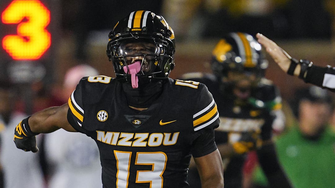 Nov 9, 2024; Columbia, Missouri, USA; Missouri Tigers safety Daylan Carnell (13) celebrates after forcing a fumble during the second half against the Oklahoma Sooners at Faurot Field at Memorial Stadium. Mandatory Credit: Jay Biggerstaff-Imagn Images
