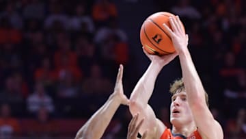 Nov 4, 2024; Champaign, Illinois, USA;  Illinois Fighting Illini guard Kasparas Jakucionis (32) shoots the ball during game with Eastern Illinois Panthers at State Farm Center. Mandatory Credit: Ron Johnson-Imagn Images