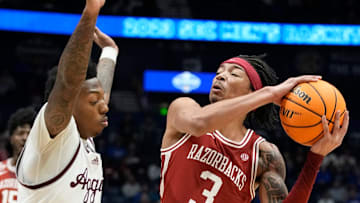 Arkansas guard Nick Smith Jr. (3) drives to the basket past Texas A&M guard Wade Taylor IV (4)