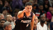 Nov 21, 2025; Phoenix, Arizona, USA; Phoenix Suns guard Collin Gillespie (12) celebrates a three point shot against the Minnesota Timberwolves in the first half of an NBA Cup game at Mortgage Matchup Center. Mandatory Credit: Mark J. Rebilas-Imagn Images
