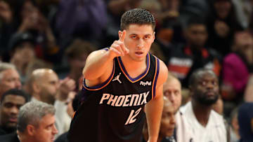 Nov 21, 2025; Phoenix, Arizona, USA; Phoenix Suns guard Collin Gillespie (12) celebrates a three point shot against the Minnesota Timberwolves in the first half of an NBA Cup game at Mortgage Matchup Center. Mandatory Credit: Mark J. Rebilas-Imagn Images
